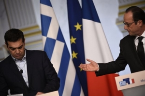 Le Monde: Φαινομενική η «συμμαχία» Τσίπρα-Ολάντ